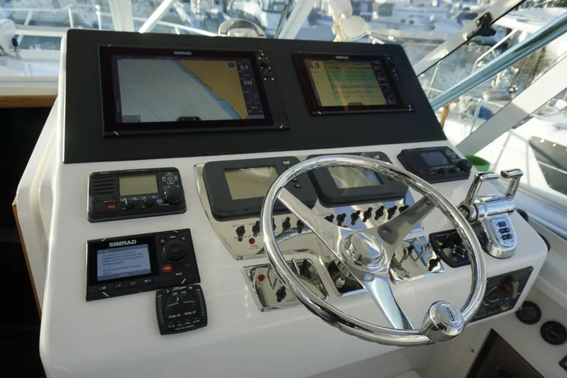 Slide: The Image of Control panel of 2005 Cabo 35 Express boat with navigation and communication equipment. - 21