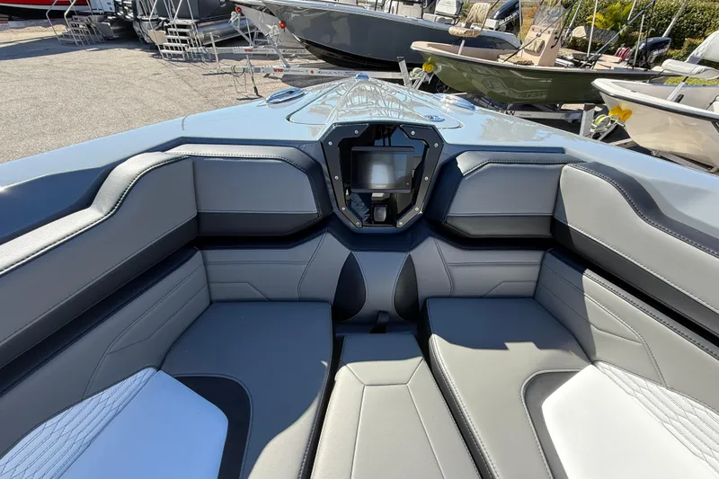 Slide: The Image of 2026 Sunsation 32 CCX boat interior with sleek gray seating and modern dashboard. - 26