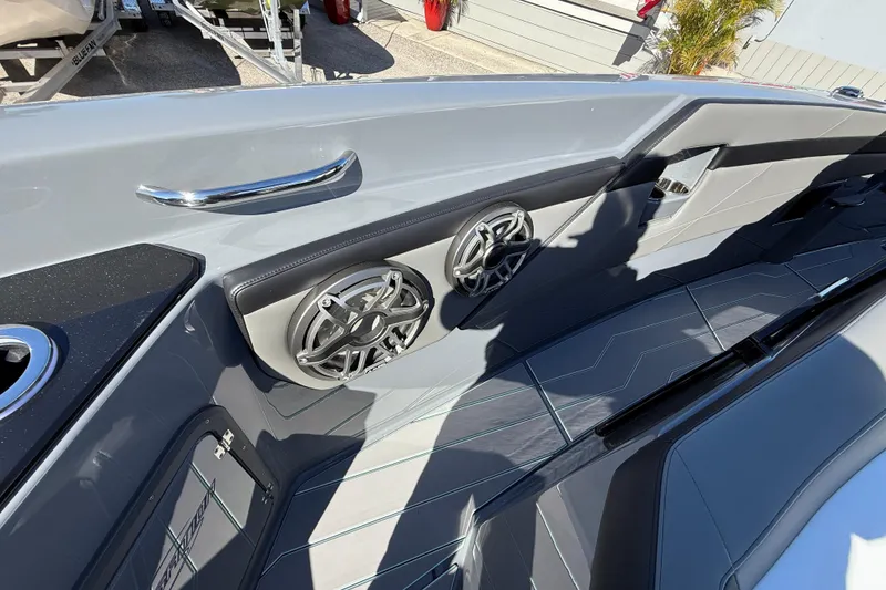 Slide: The Image of 2026 Sunsation 32 CCX boat interior with sleek design and modern audio system. - 30