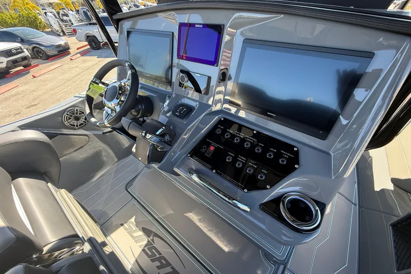 Slide: The Image of 2026 Sunsation 32 CCX boat dashboard with advanced navigation screens and controls. - 34