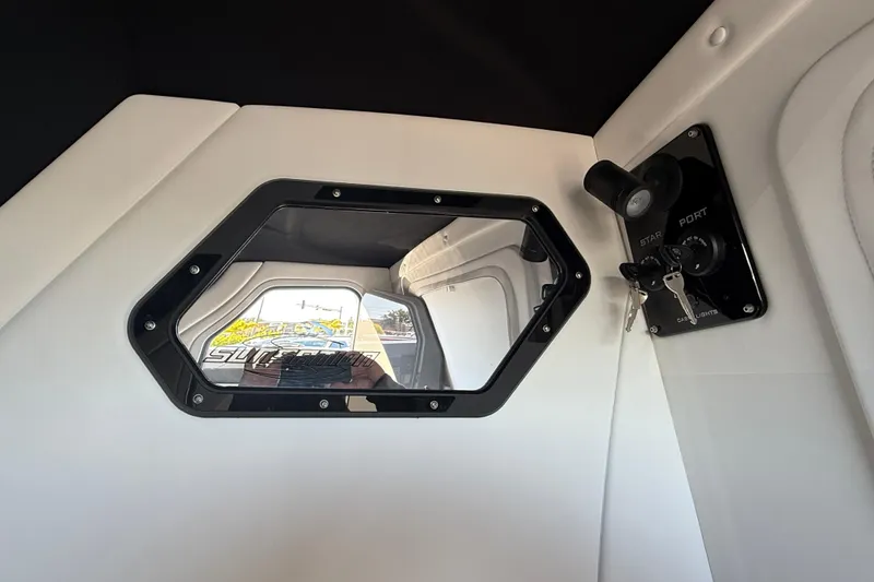 Slide: The Image of Interior view of 2026 Sunsation 32 CCX boat cabin with window and control panel. - 38