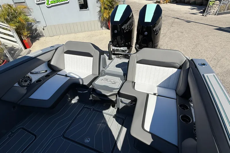 Slide: The Image of 2026 Sunsation 32 CCX boat interior with stylish seating and twin outboard engines. - 40