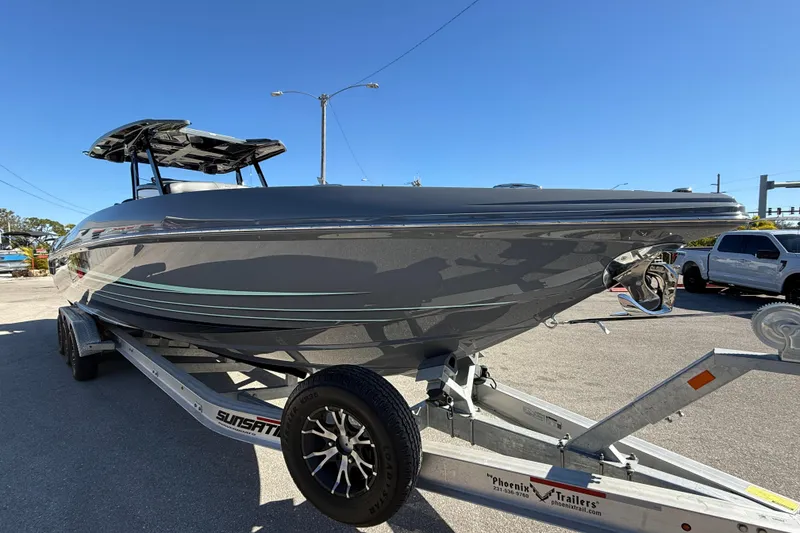 Slide: The Image of 2026 Sunsation 32 CCX boat on trailer under clear blue sky. - 5