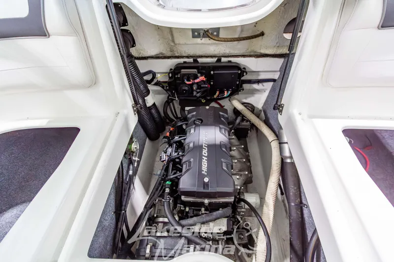Slide: The Image of 2014 Yamaha SX190 boat engine compartment showcasing high output engine components. - 13