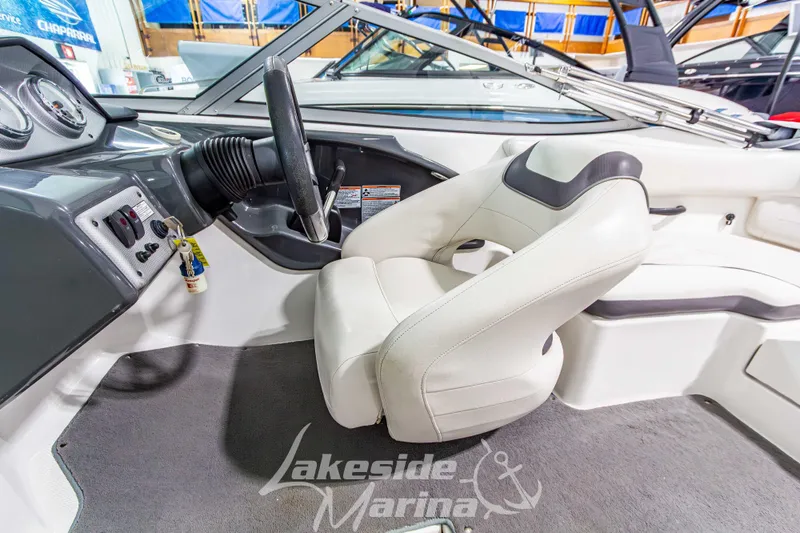 Slide: The Image of 2014 Yamaha Boats SX190 interior with steering wheel and captain's seat at Lakeside Marina. - 18