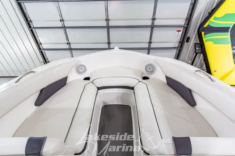 Slide: The Image of 2014 Yamaha Boats SX190 interior with white seating and speakers in a garage setting. - 22