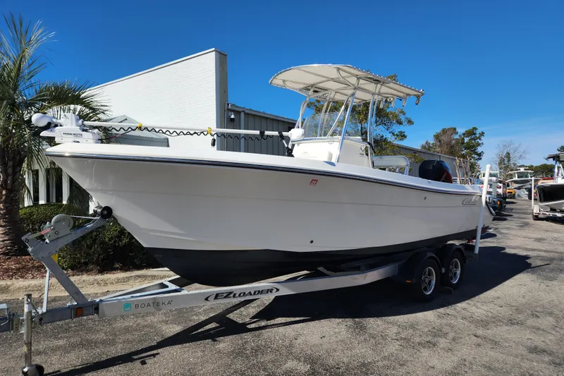 Slide: The Image of Close-up of a 2021 Cobia 237 Center Console boat display showing hours, battery, and RPM. - 12