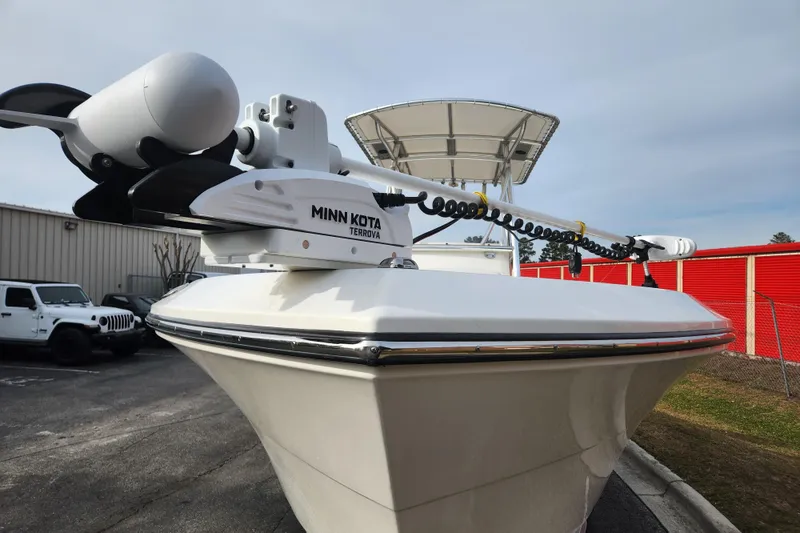 Slide: The Image of 2021 Cobia 237 Center Console boat interior with steering wheel and control panel. - 14