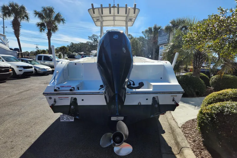 Slide: The Image of 2021 Cobia 237 Center Console boat with T-top in storage facility. - 15