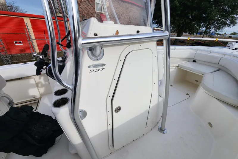 Slide: The Image of 2021 Cobia 237 Center Console boat interior with seating and console details. - 18
