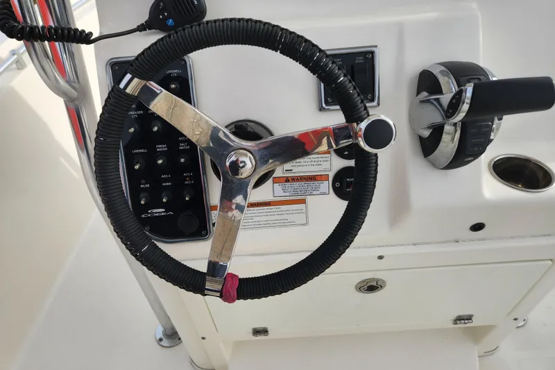 Slide: The Image of 2021 Cobia 237 Center Console boat interior wiring and components view. - 23