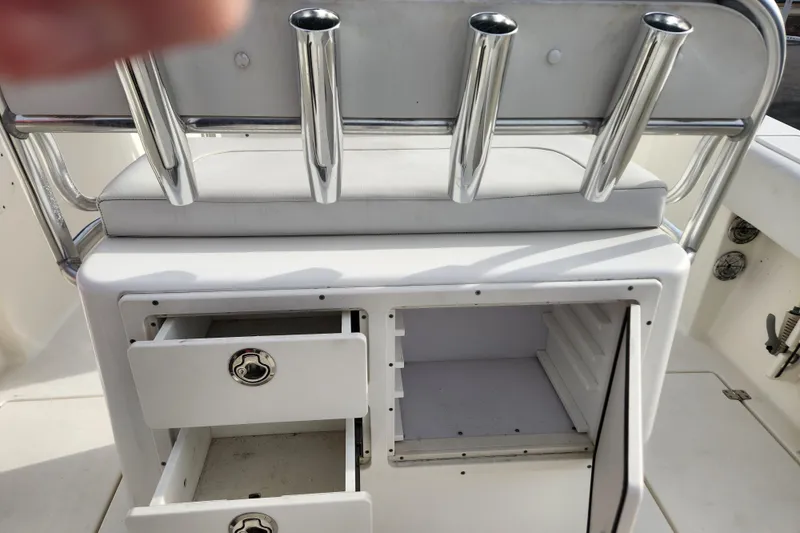 Slide: The Image of 2021 Cobia 237 Center Console boat interior with livewell and storage compartments. - 25