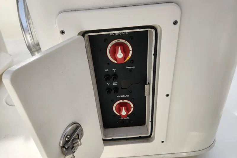 Slide: The Image of Trailer hitch for 2021 Cobia 237 Center Console boat, parked on asphalt near brick building. - 26