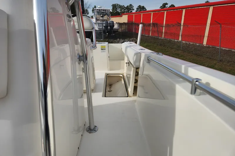 Slide: The Image of 2021 Cobia 237 Center Console boat interior with open storage compartment. - 8