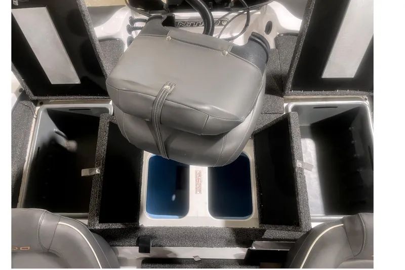 Slide: The Image of 2021 Nitro Z18 boat interior with open storage compartments and seating. - 10