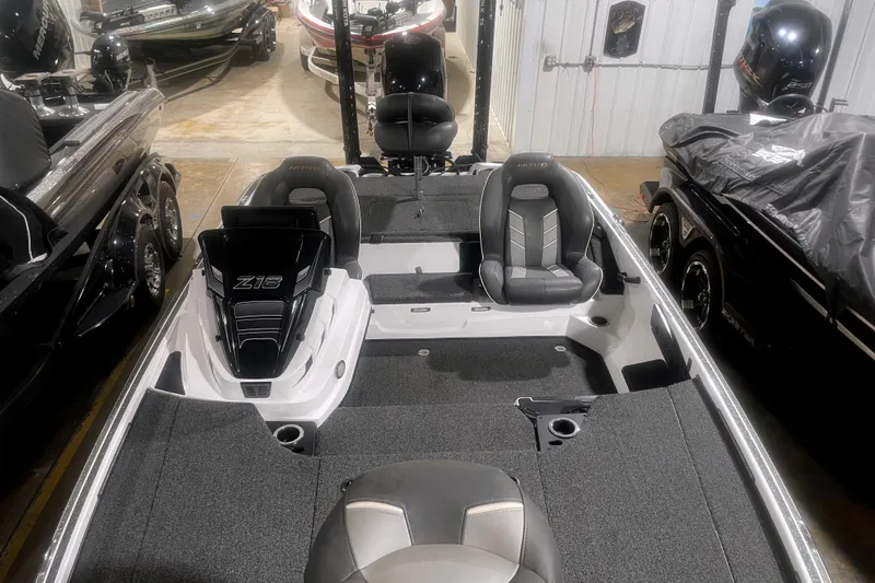 Slide: The Image of 2021 Nitro Z18 boat interior with seating and storage compartments in a showroom. - 7