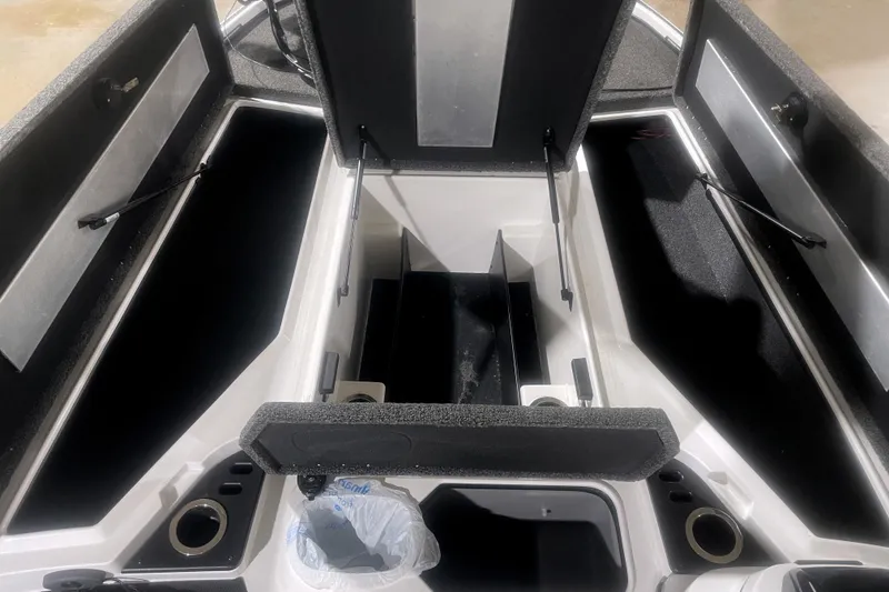 Slide: The Image of 2021 Nitro Z18 boat storage compartments with open lids, showcasing spacious interior design. - 8