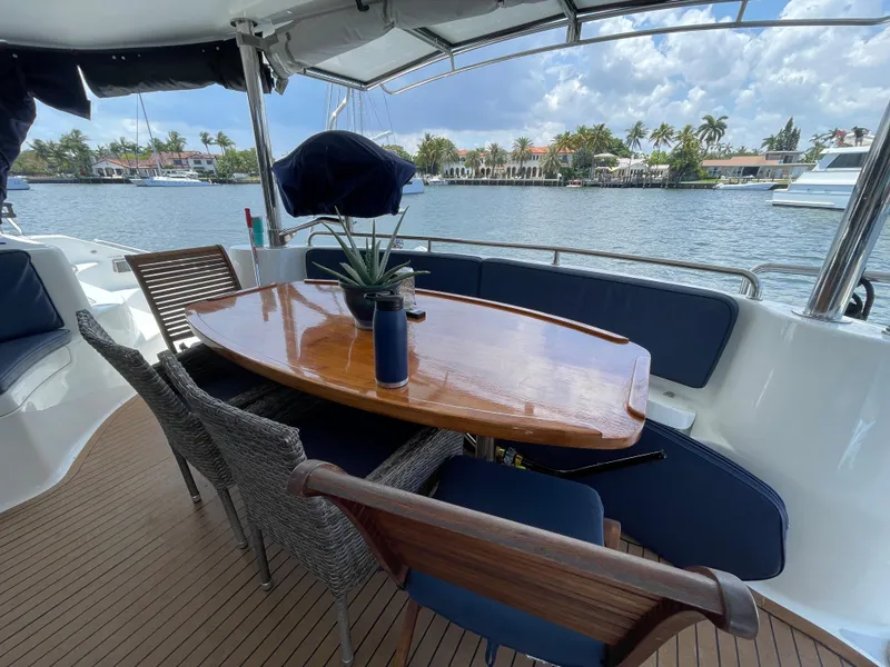 Slide: The Image of Knysna 500 SE 2016 yacht with elegant deck setup and water view. - 10