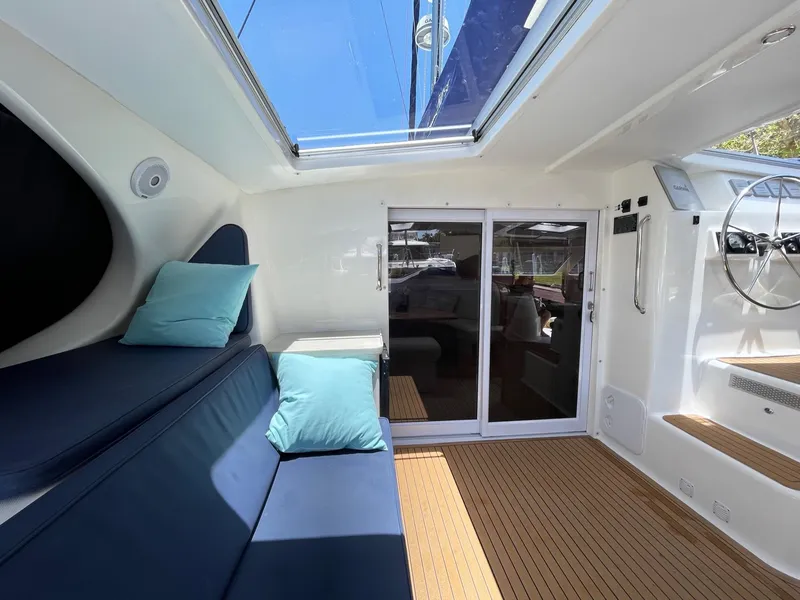 Slide: The Image of Interior of a 2016 Knysna 500 SE yacht with blue cushions. - 12