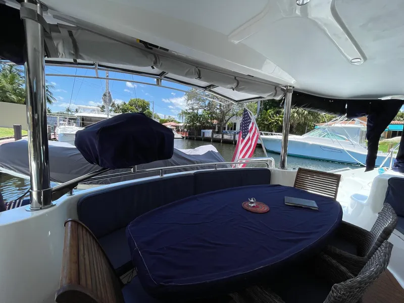 Slide: The Image of Knysna 500 SE 2016 yacht with covered seating area and table. - 14