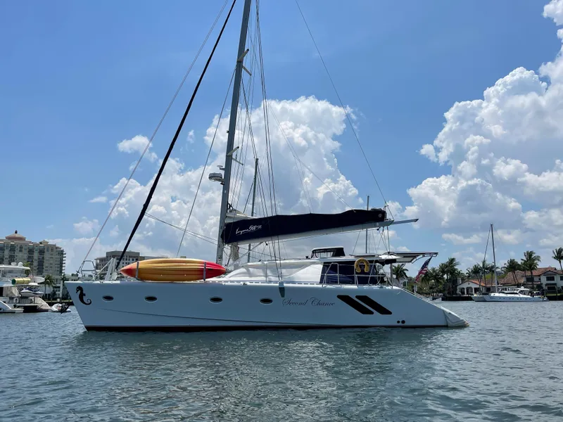 Slide: The Image of 2016 Knysna 500 SE sailing catamaran on calm waters. - 2