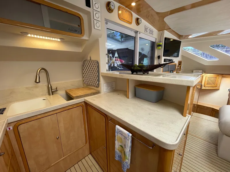 Slide: The Image of Interior of 2016 Knysna 500 SE yacht featuring modern kitchen. - 23