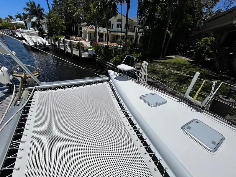 Slide: The Image of Knysna 500 SE 2016 catamaran docked with tropical backdrop. - 34