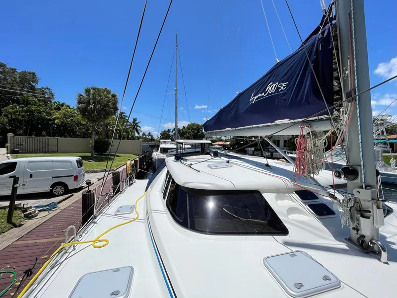 Slide: The Image of 2016 Knysna 500 SE catamaran docked on a sunny day. - 37