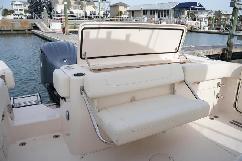 Slide: The Image of 2023 Grady-White Canyon 306 boat with foldable seating at marina dock. - 16