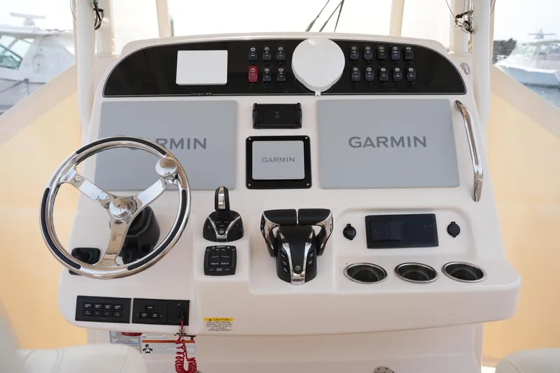 Slide: The Image of 2023 Grady-White Canyon 306 helm with Garmin navigation and control systems. - 25