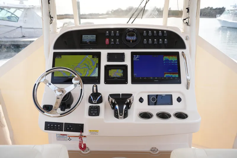 Slide: The Image of 2023 Grady-White Canyon 306 helm with advanced navigation and control systems. - 26