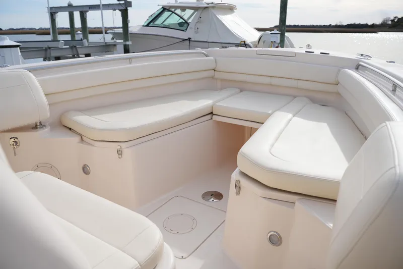 Slide: The Image of 2023 Grady-White Canyon 306 boat interior with white cushioned seating. - 37