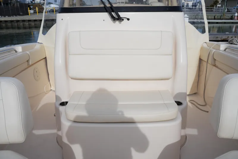Slide: The Image of 2023 Grady-White Canyon 306 boat interior with white seating and cup holders. - 40