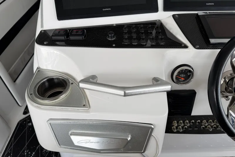 Slide: The Image of 2017 Cigarette 41' GTR boat dashboard with controls and steering wheel. - 17