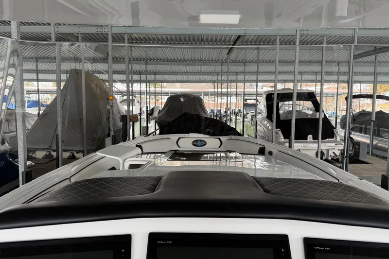 Slide: The Image of 2017 Cigarette 41' GTR boat docked in covered marina storage. - 18