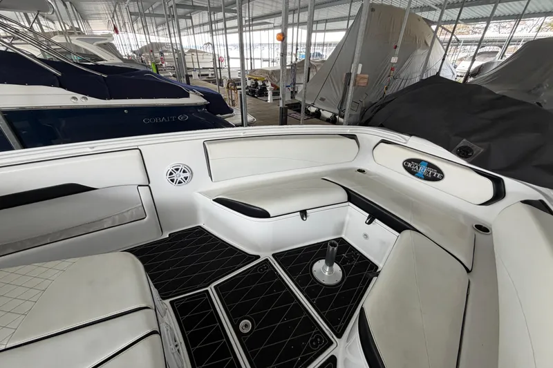 Slide: The Image of 2017 Cigarette 41' GTR boat interior with white seating in marina. - 21