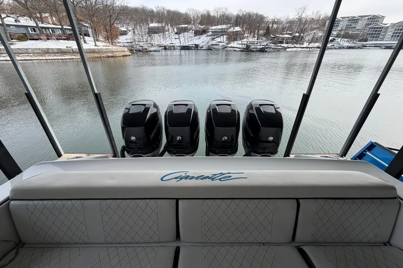 Slide: The Image of 2017 Cigarette 41' GTR boat with four powerful engines, docked on a serene lake. - 26