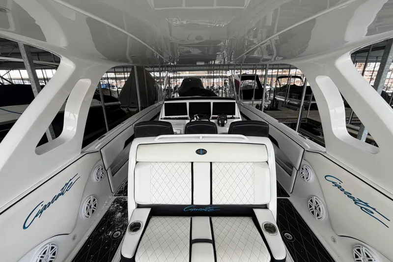 Slide: The Image of Interior of a 2017 Cigarette 41' GTR boat with luxury seating and modern dashboard. - 28