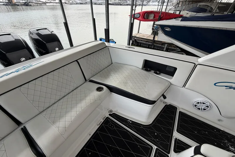Slide: The Image of 2017 Cigarette 41' GTR boat interior with cushioned seating and outboard motors. - 30