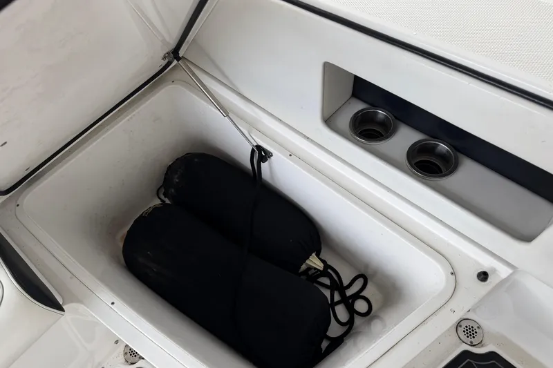 Slide: The Image of Storage compartment in 2017 Cigarette 41' GTR boat with fenders and cup holders. - 31