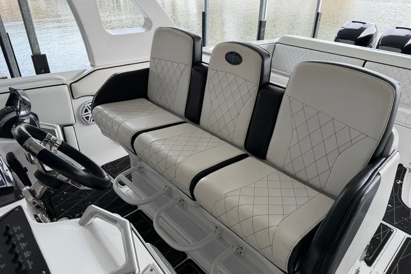 Slide: The Image of Luxurious seating in a 2017 Cigarette 41' GTR boat, featuring diamond-stitched upholstery. - 34