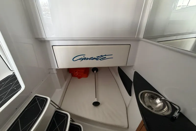 Slide: The Image of 2017 Cigarette 41' GTR boat interior with sink and storage area. - 36