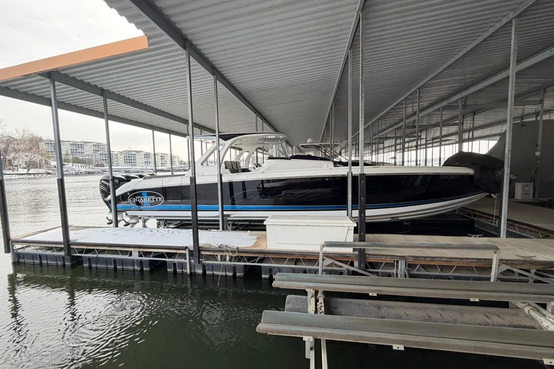 Slide: The Image of 2017 Cigarette 41' GTR boat docked under a covered marina. - 6