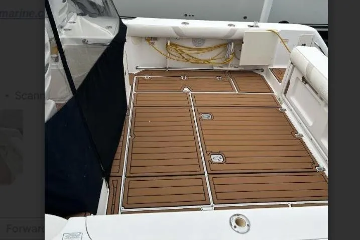 Slide: The Image of 2004 Boston Whaler 305 Conquest boat deck with wood finish. - 19