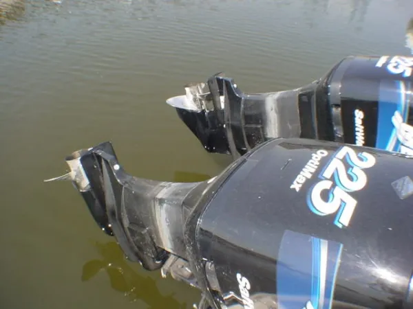 Slide: The Image of Two outboard motors on a 2004 Boston Whaler 305 Conquest boat. - 5