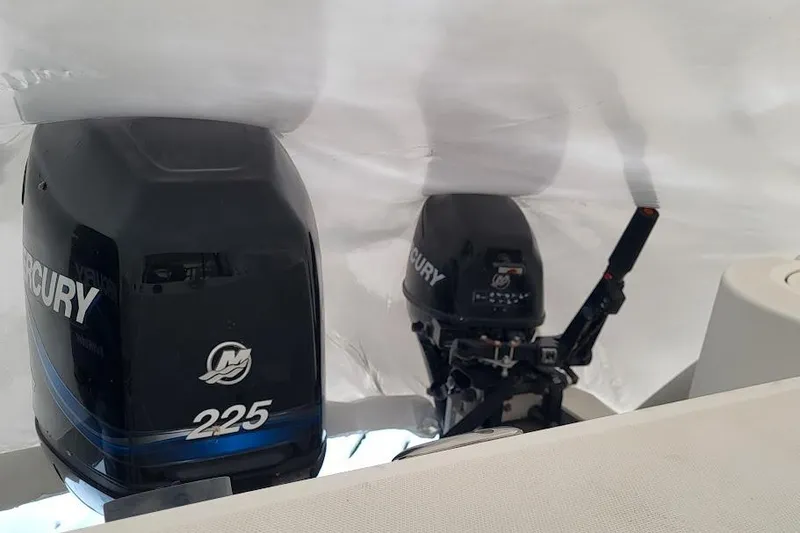 Slide: The Image of 2004 Boston Whaler 305 Conquest with dual Mercury 225 outboard engines. - 6