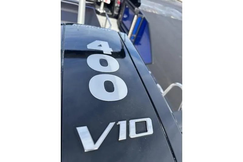 Slide: The Image of Close-up of 2025 Bennington M Swingback 26 MSB with 400 V10 engine. - 10