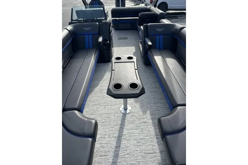 Slide: The Image of 2025 Bennington M Swingback 26 MSB interior with sleek seating and central table. - 12