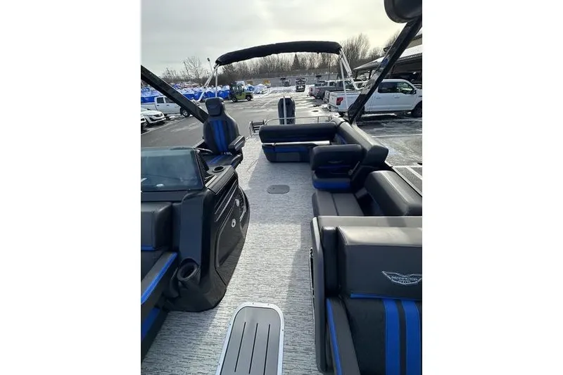 Slide: The Image of 2025 Bennington M Swingback 26 MSB pontoon boat with luxurious seating and modern design. - 15