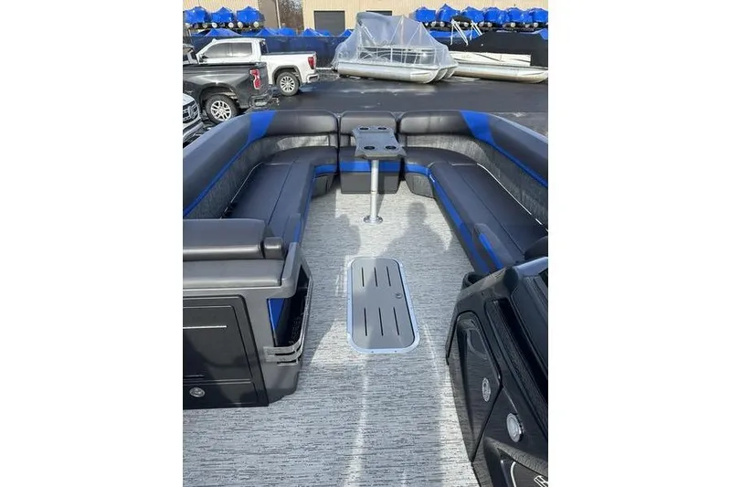 Slide: The Image of 2025 Bennington M Swingback 26 MSB pontoon boat interior with seating and table. - 16